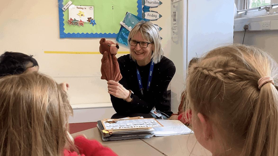 Teacher showing Ted to pupils in a NELI group session at Henleaze